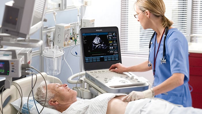 Echocardiologist treating cardiovascular disease patient