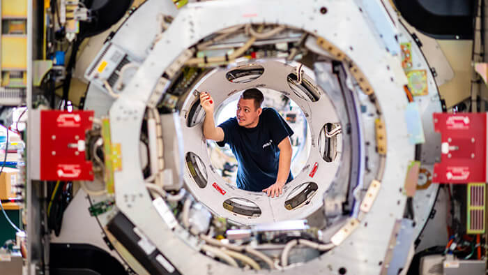 Man adjusting the parts of the machine